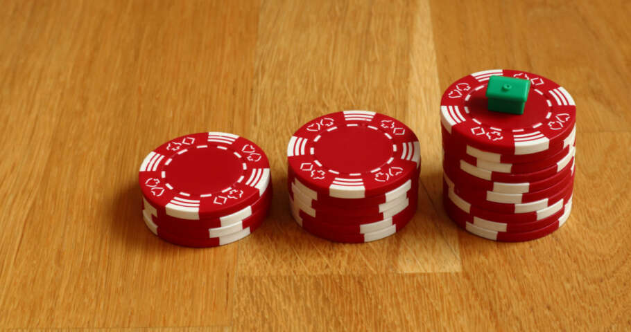 Red poker chips sitting on a table