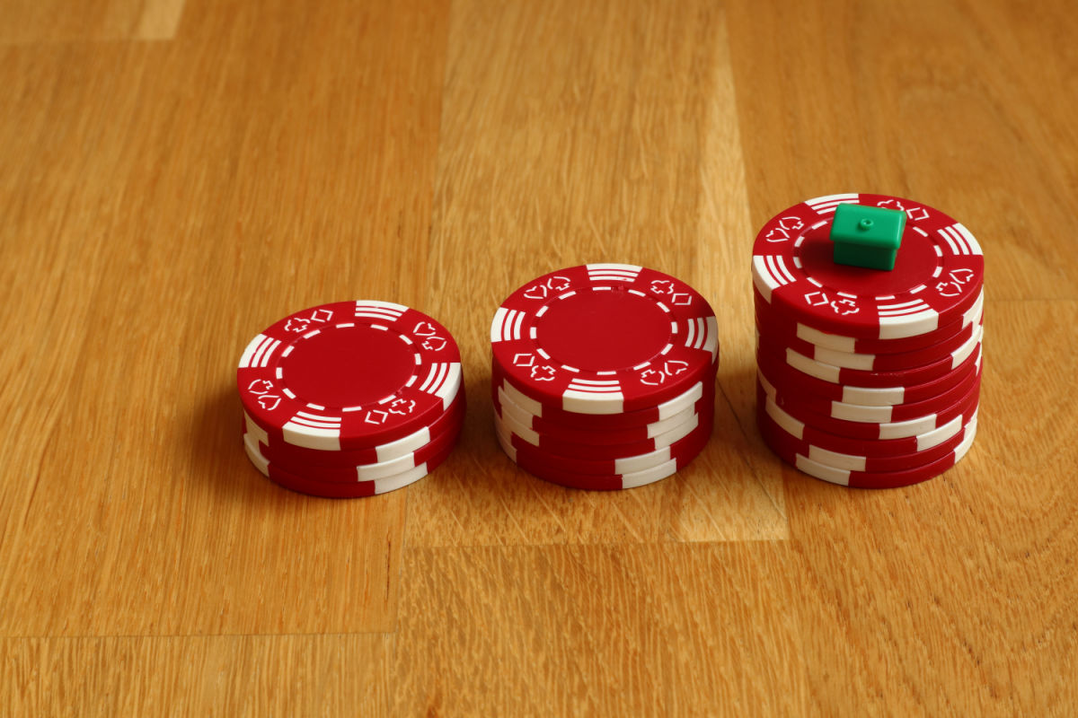 Red poker chips sitting on a table